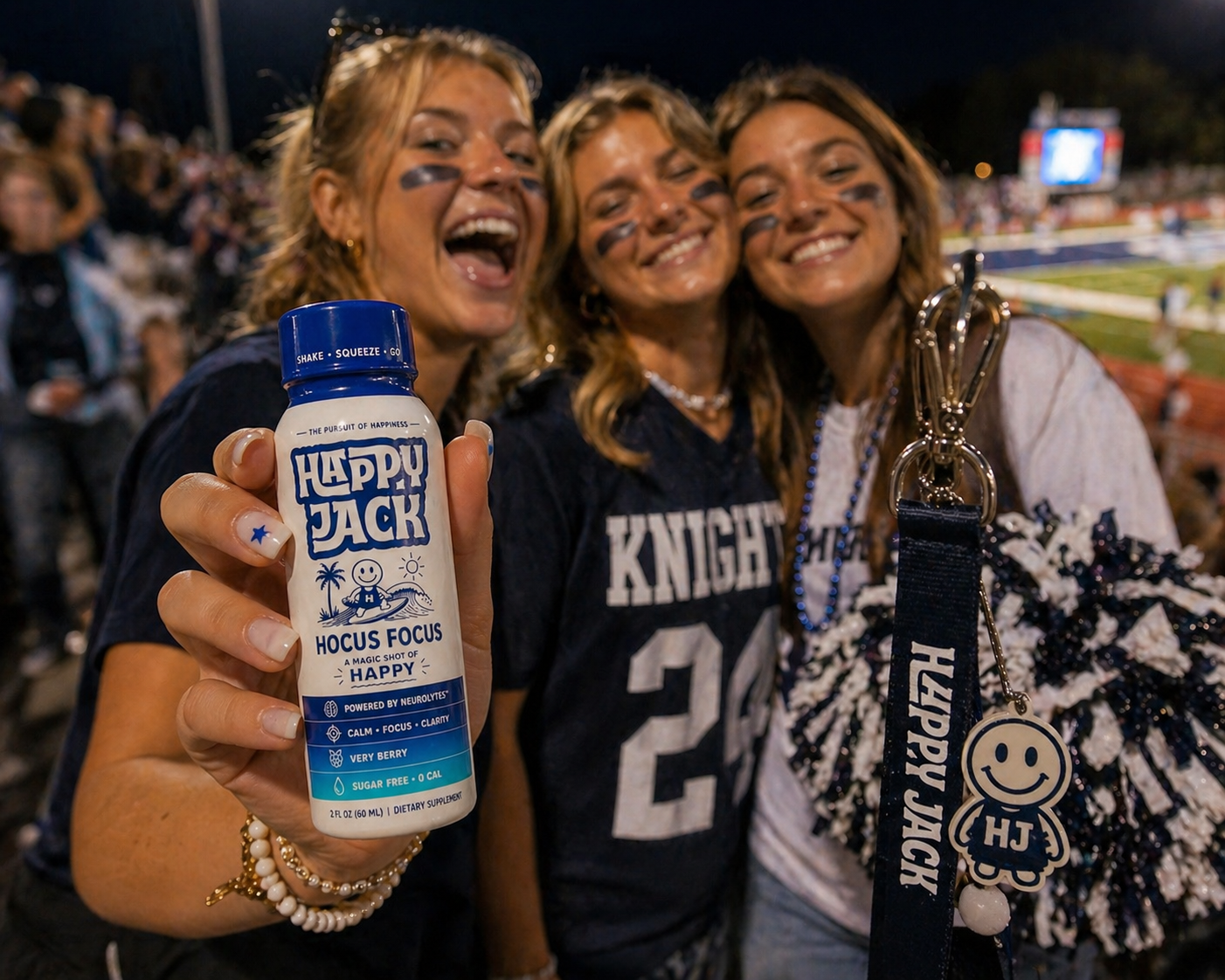 Friends at a Knights football game holding a Happy Jack Hocus Focus shot